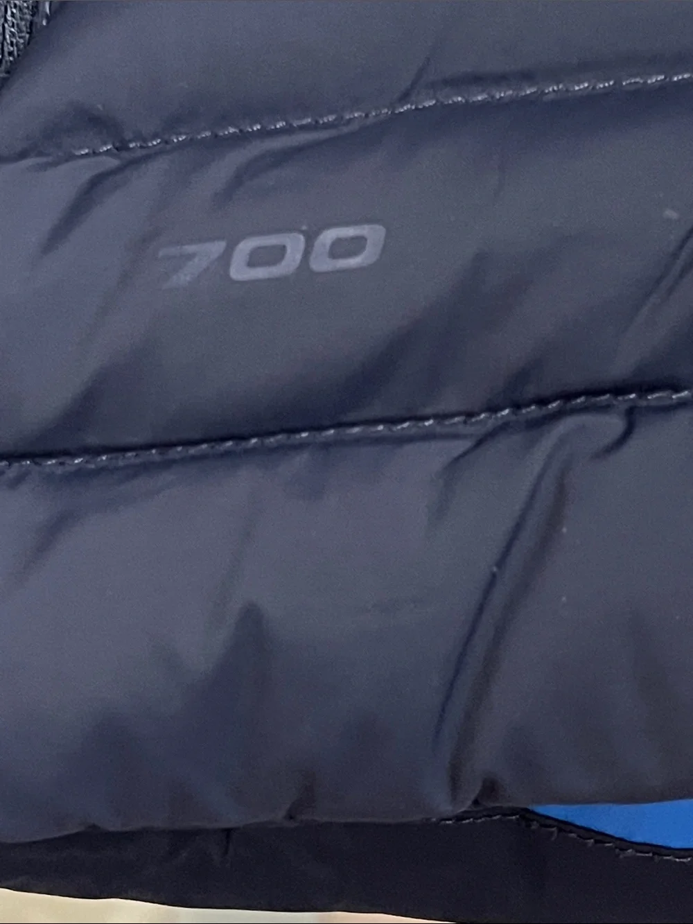 The North Face Black Quilted Down Vest with Blue Lining and Orange Logo